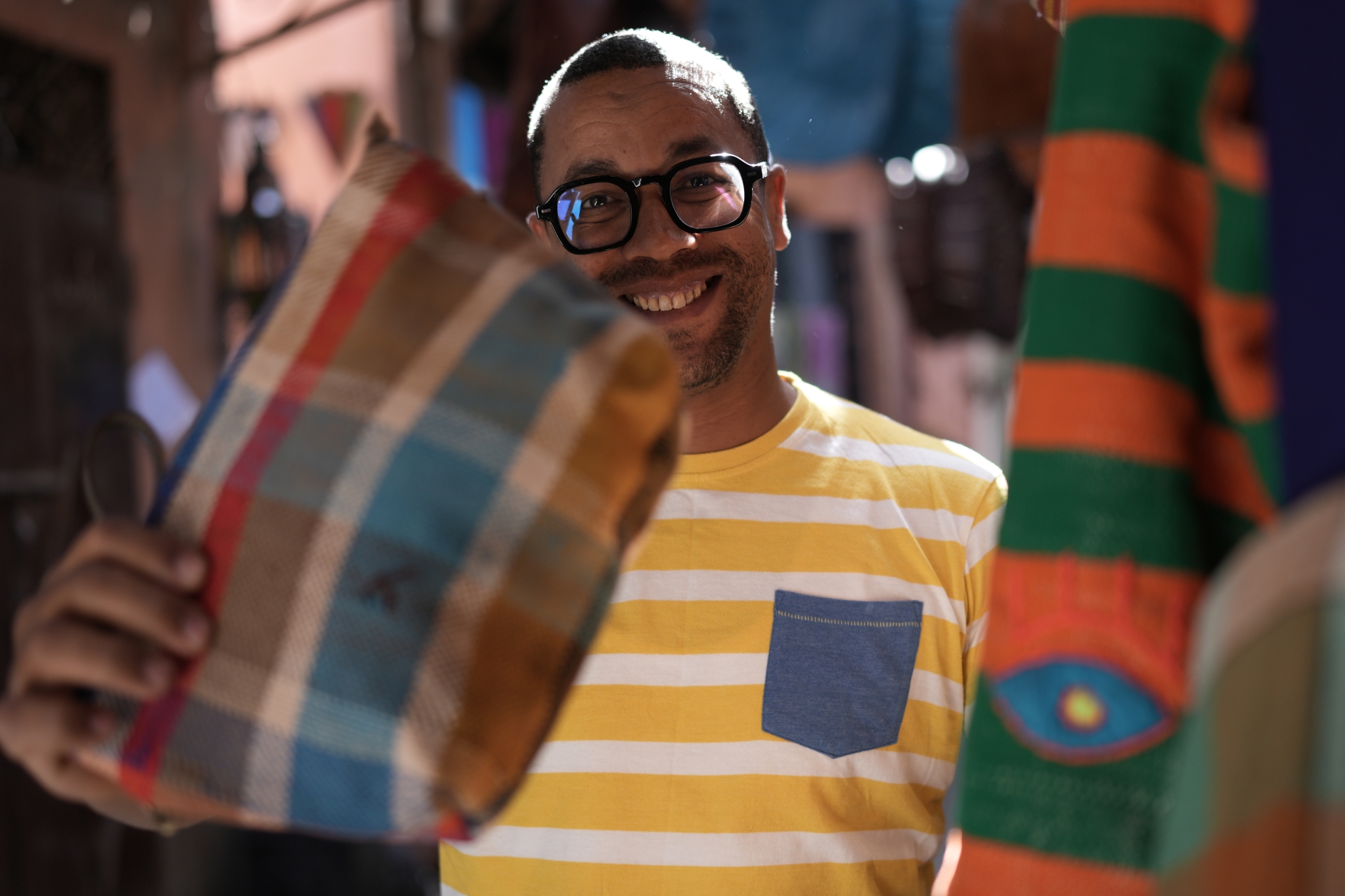 Sample image of a man holding a bag and looking toward the camera Creative Look: Neutral Click to open modal