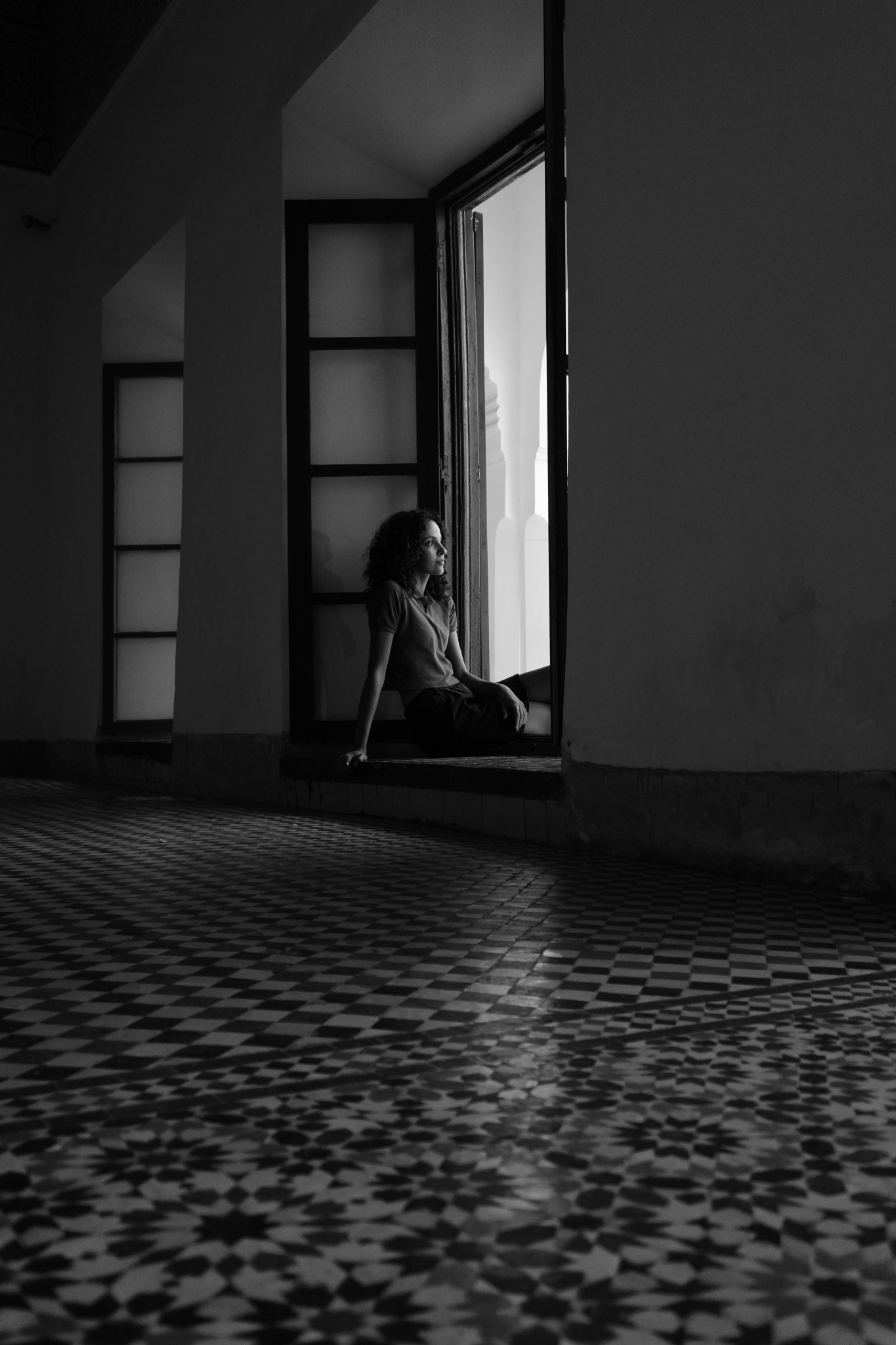 Sample image of a woman sitting by the window Creative Look: Black & White