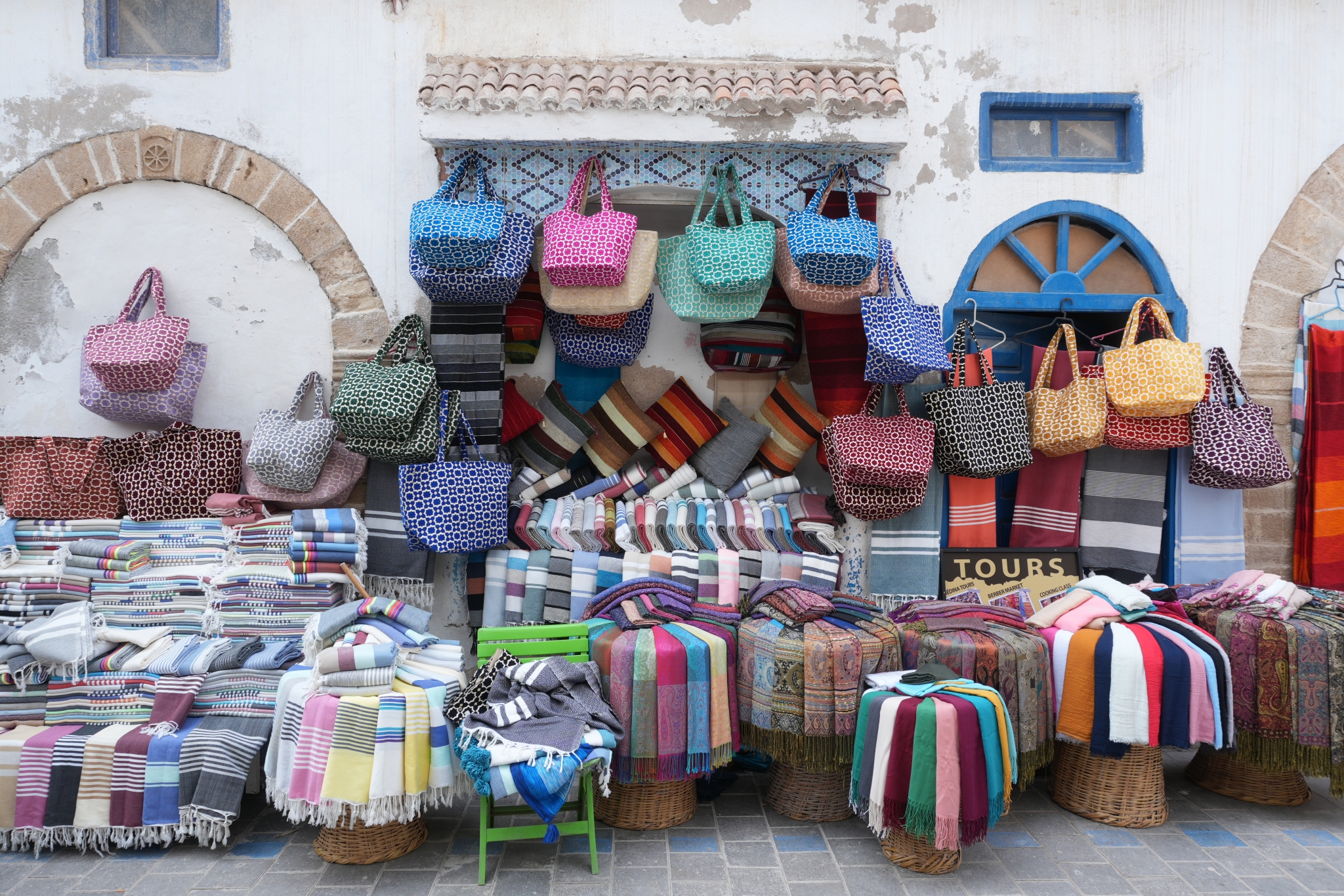 Sample image of a Moroccan market stall with a variety of colourful bags and fabrics on display, showing the resolution