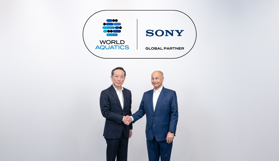 The heads of companies World Aquatics and Sony Corporation shake hands.