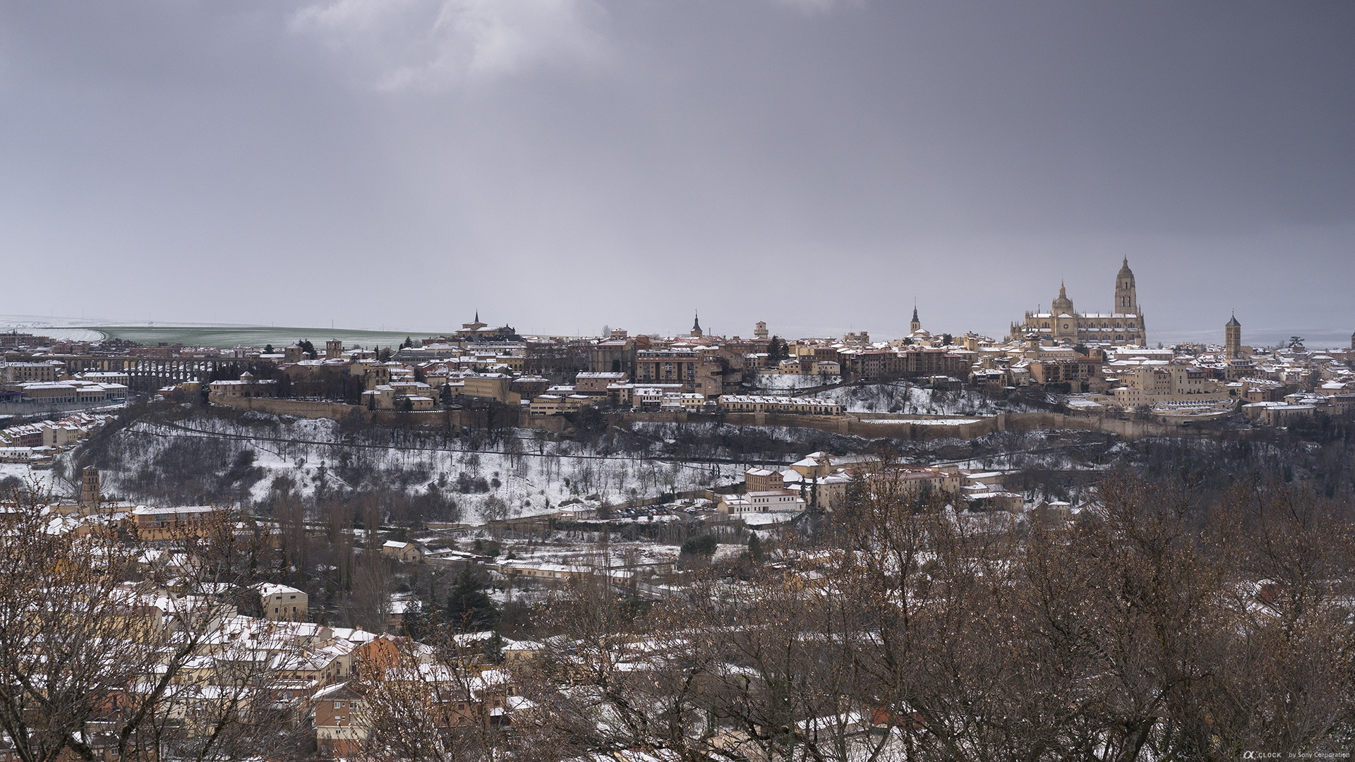 Sony Global A Clock World Time Captured By A Old Town Of Segovia And Its Aqueduct