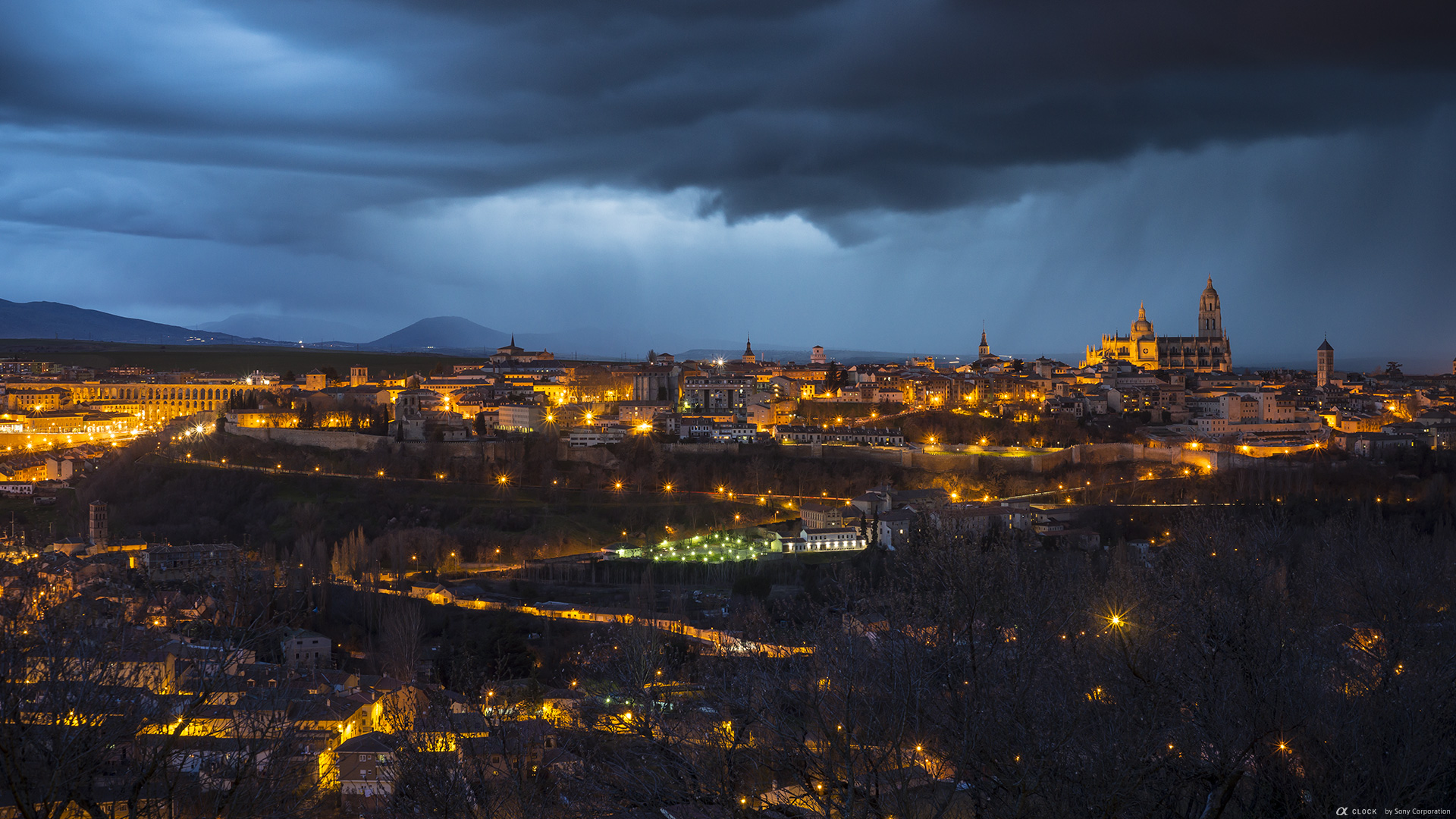 Sony Global A Clock World Time Captured By A Old Town Of Segovia And Its Aqueduct